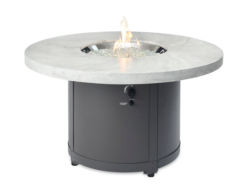 White Onyx Beacon Round Gas Fire Pit Table — with the burner lit